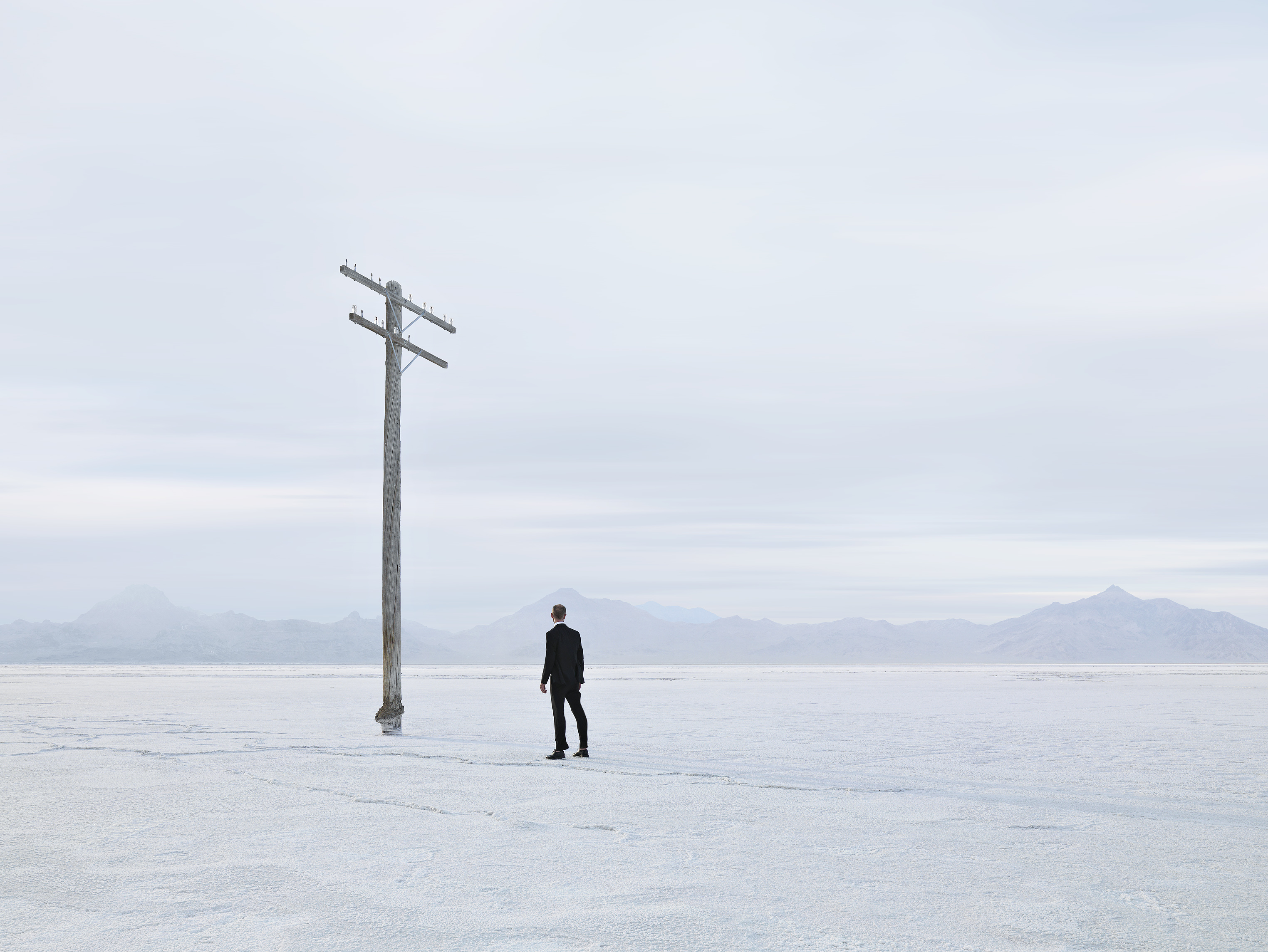 Man and Pole in Salt Flats